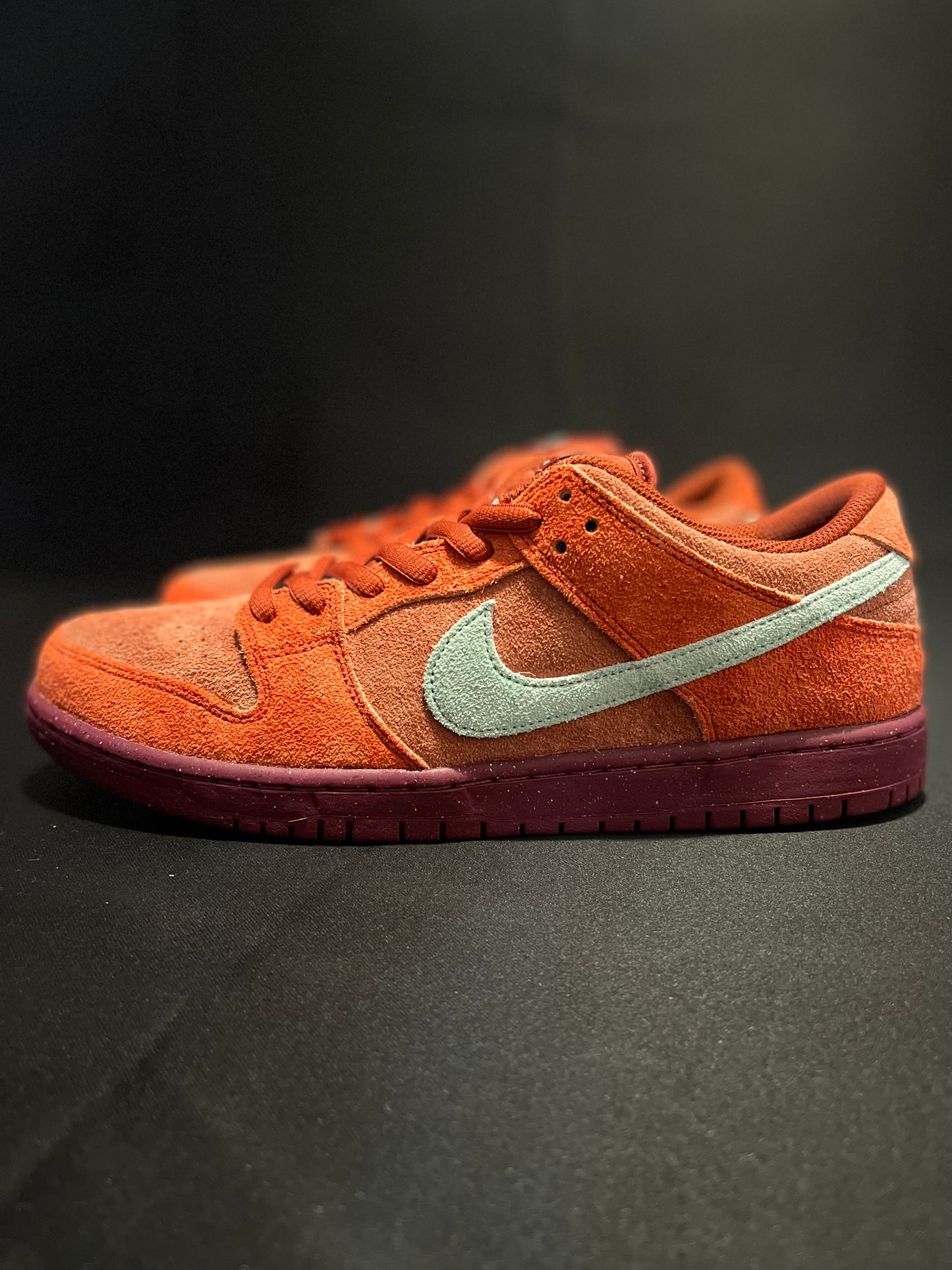 Nike SB Dunk Low Mystic Red Rosewood sneakers - Iconic retro style with plush suede in Mystic Red. DV0833-600 Men's Sneakers. Elevate your streetwear game. #NikeSBDunk #MysticRedRosewood