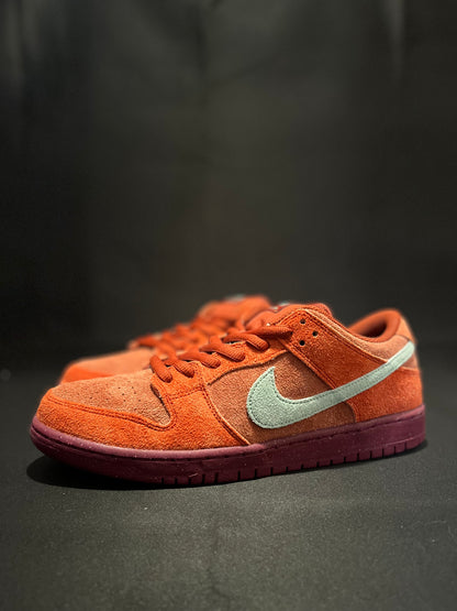 Nike SB Dunk Low Mystic Red Rosewood sneakers - Iconic retro style with plush suede in Mystic Red. DV0833-600 Men's Sneakers. Elevate your streetwear game. #NikeSBDunk #MysticRedRosewood