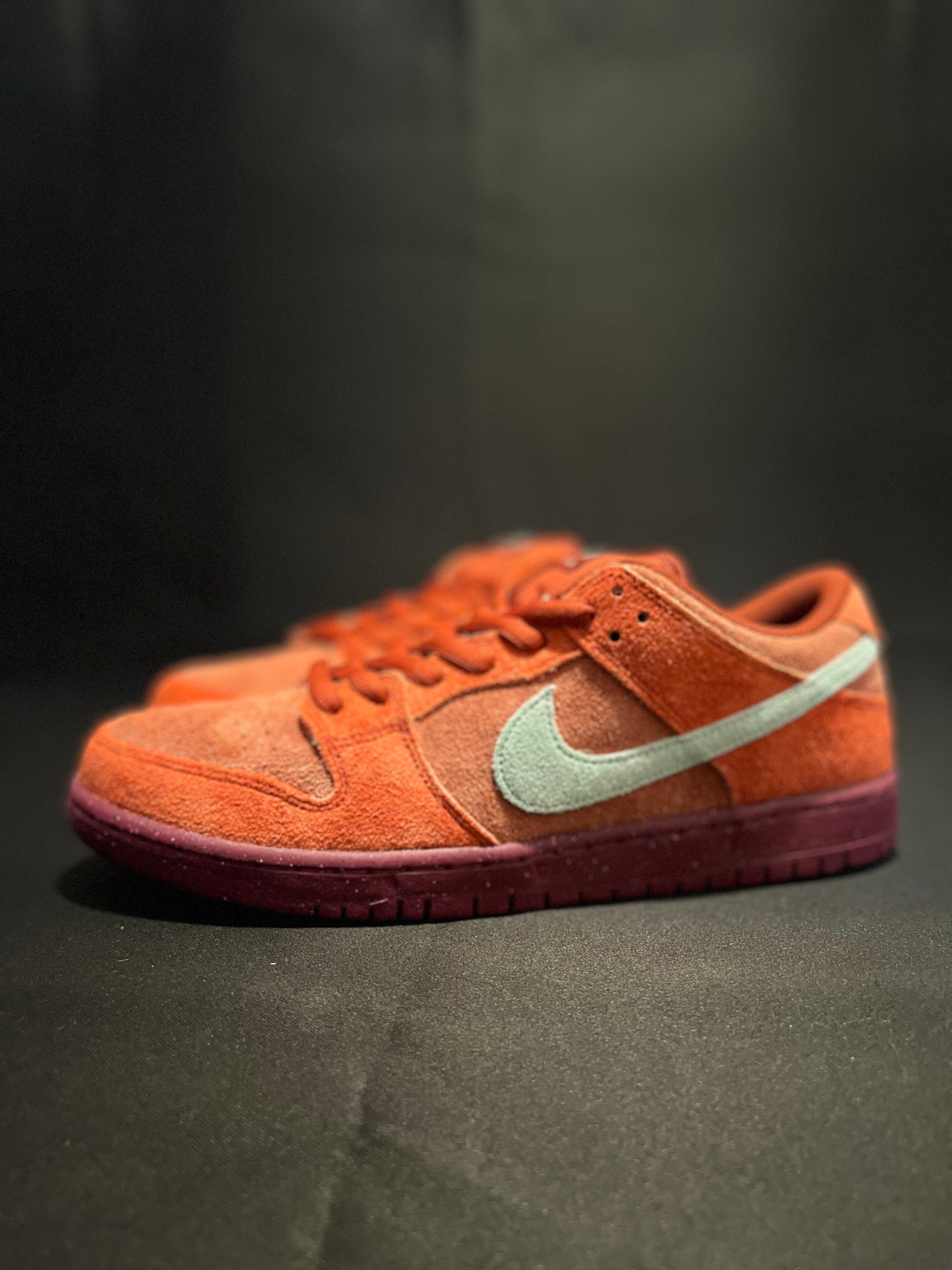 Nike SB Dunk Low Mystic Red Rosewood sneakers - Iconic retro style with plush suede in Mystic Red. DV0833-600 Men's Sneakers. Elevate your streetwear game. #NikeSBDunk #MysticRedRosewood