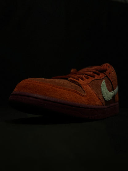 Nike SB Dunk Low Mystic Red Rosewood sneakers - Iconic retro style with plush suede in Mystic Red. DV0833-600 Men's Sneakers. Elevate your streetwear game. #NikeSBDunk #MysticRedRosewood